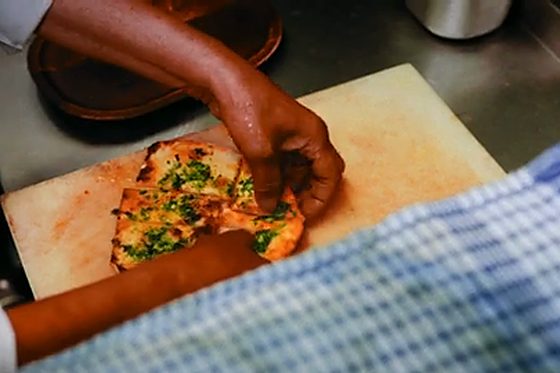 Garlic naan fresh from the SCV3 on a wooden board