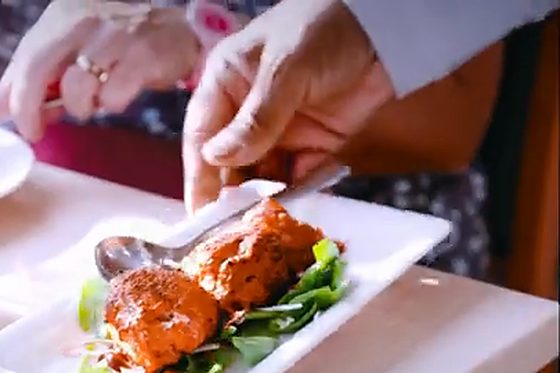 Chicken tikka served on a bed of spinach